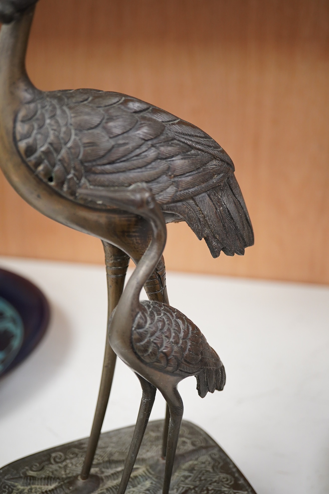 A Japanese bronze group of cranes, 19th century, 39cm high. Condition - section missing from prey in mouth